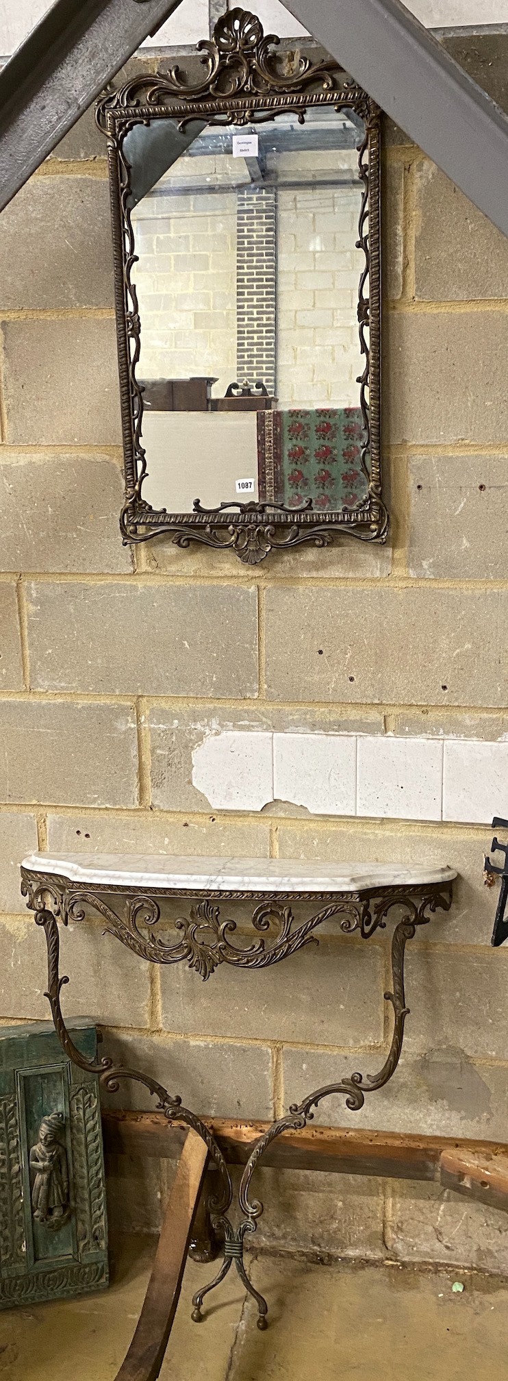 A bronzed metal and reconstituted marble console table, width 82cm, height 92cm and mirror
